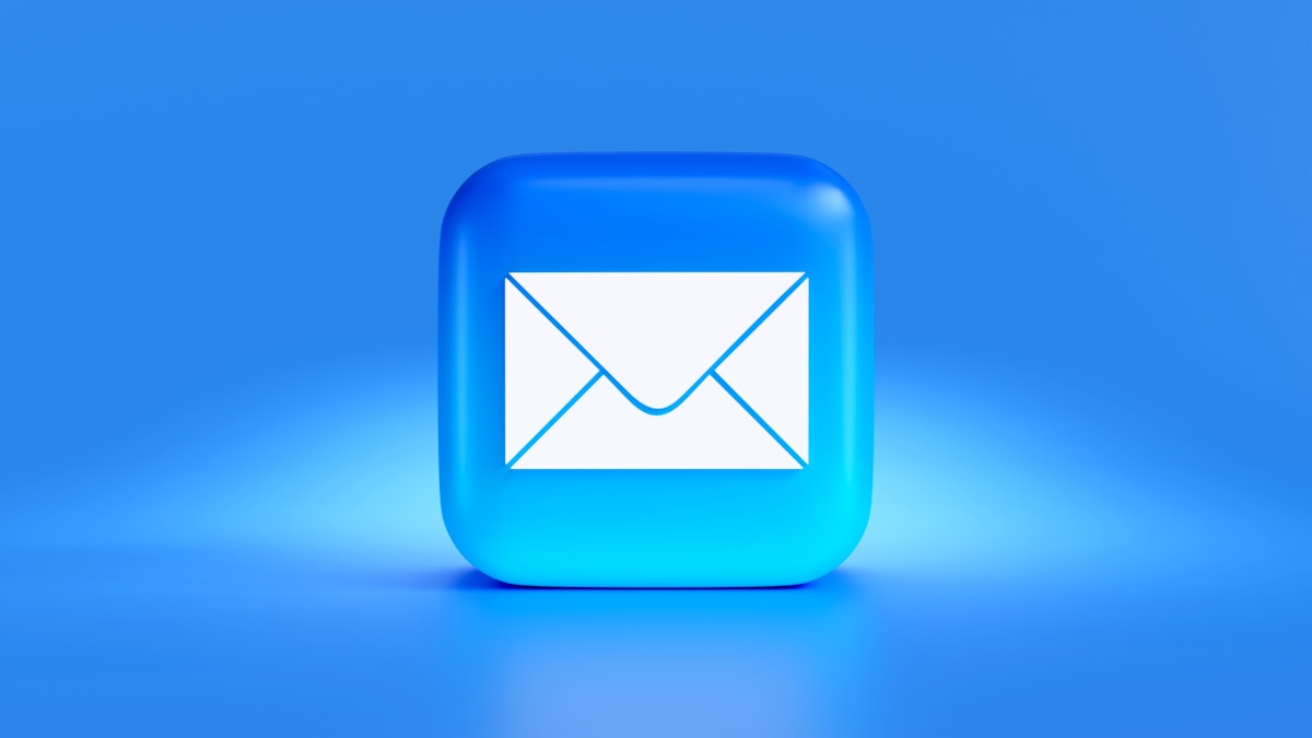 Photo by Mariia Shalabaieva a blue button with a white envelope on it