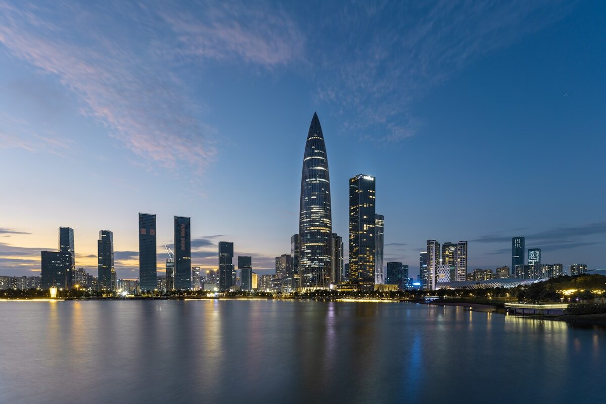 Shenzhen a large body of water with a city in the background