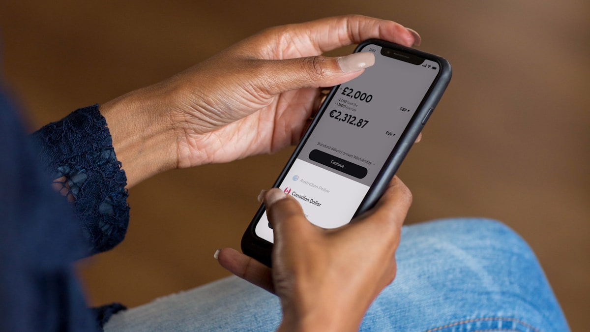 Banking App a woman holding a cell phone in her hand