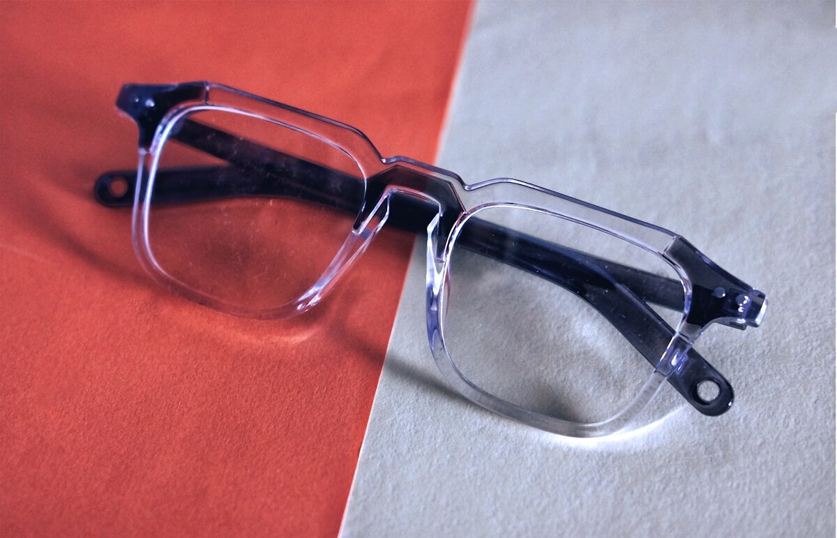 Smartglasses a pair of glasses sitting on top of a table
