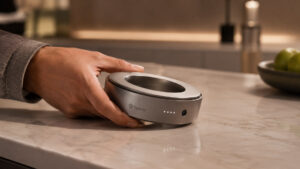 OpenAI’s first device is a doughnut-shaped smart speaker the size of a hockey puck with moving parts and a $300 to $400 price
